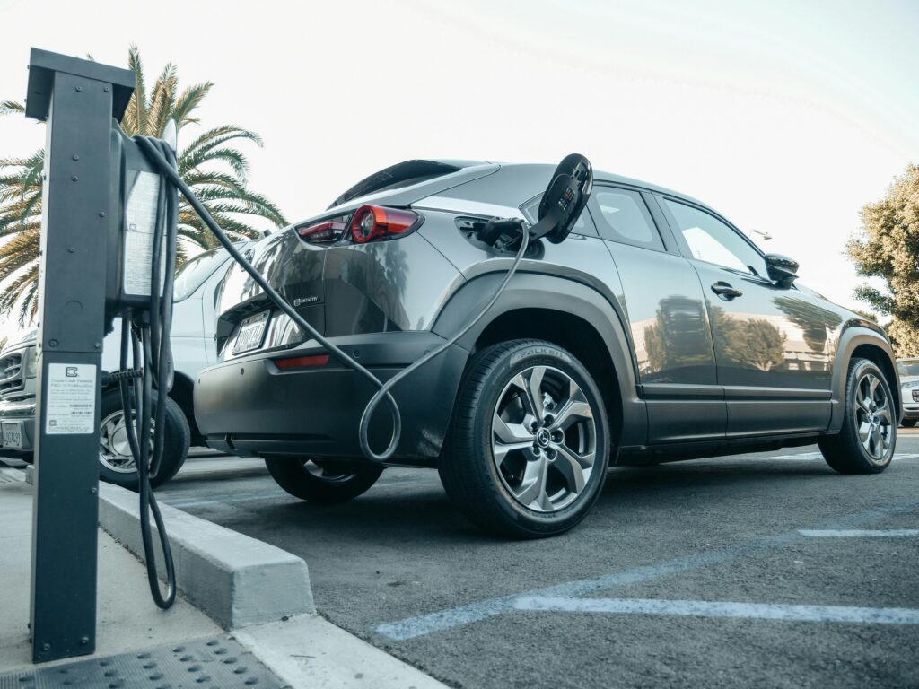 Electric vehicle connected to a charging station managed by OCPP backend software.